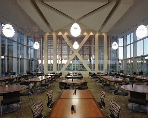 Dining Room with high ceiling and glass walls on all sides